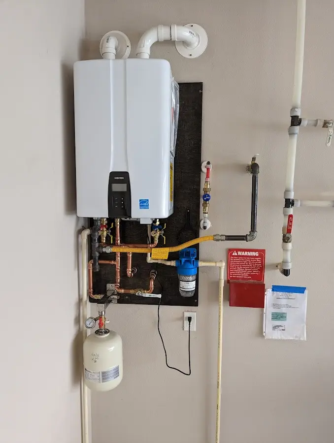 Professional plumber installing copper piping in a Port Lavaca home